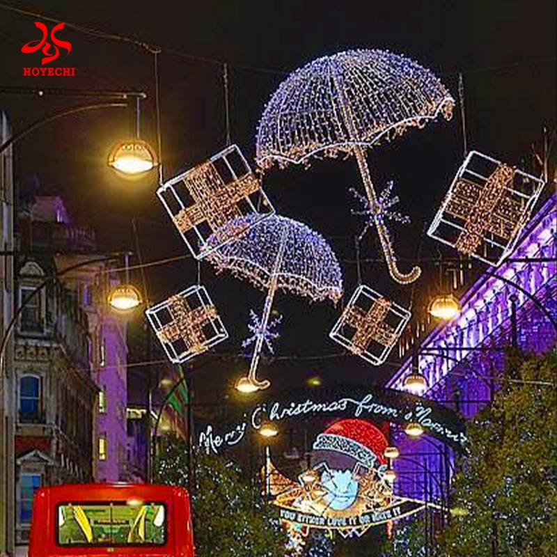 Outdoor hanging umbrella motif lights decorating streets for festive ambiance