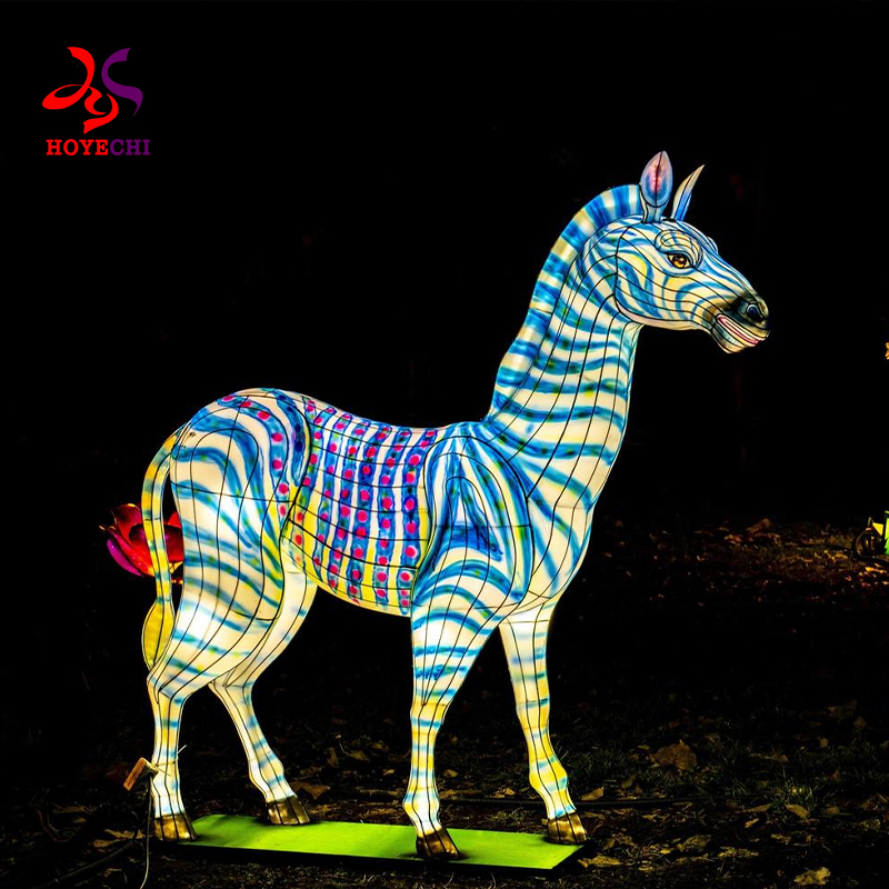 Colorful animal-shaped lanterns arranged in garden festival area