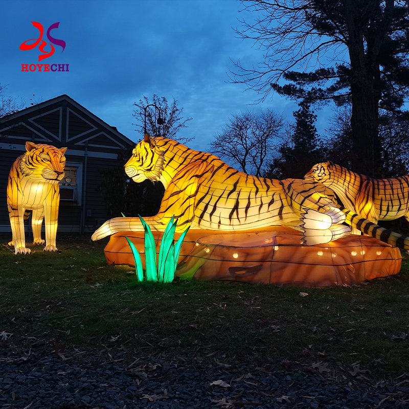 Festival animal lanterns illuminating public garden at night