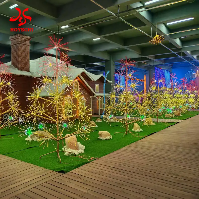 RGB Firework Tree Light with blue and purple LED starburst branches in outdoor park