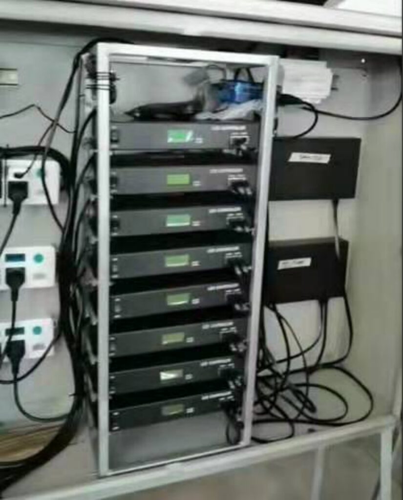 DMX control cabinet with main controller and sub-controllers for a giant pixel Christmas tree