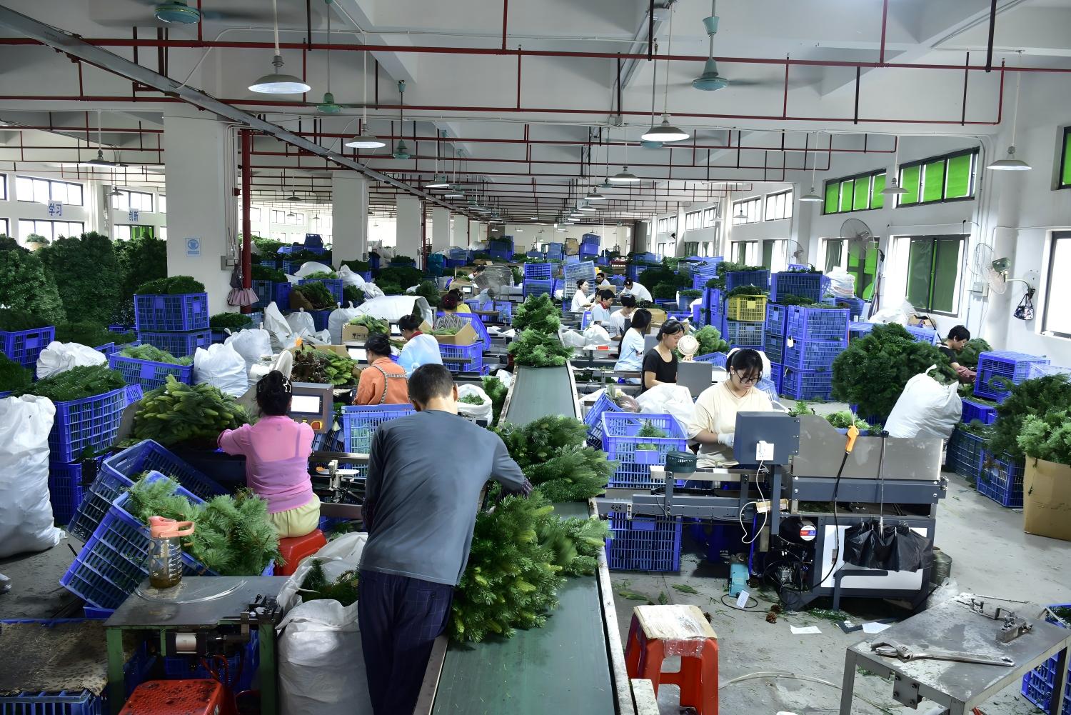 Factory production line for artificial PVC branches used in commercial Christmas trees
