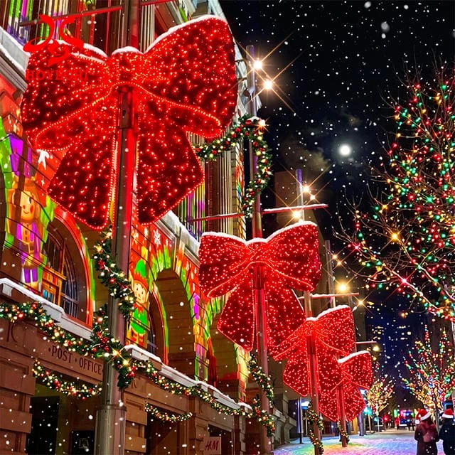 Concept rendering of red illuminated bow decorations displayed on street poles