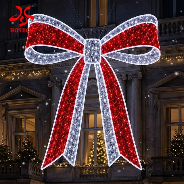 Concept rendering of a red-and-white illuminated bow displayed against a building façade