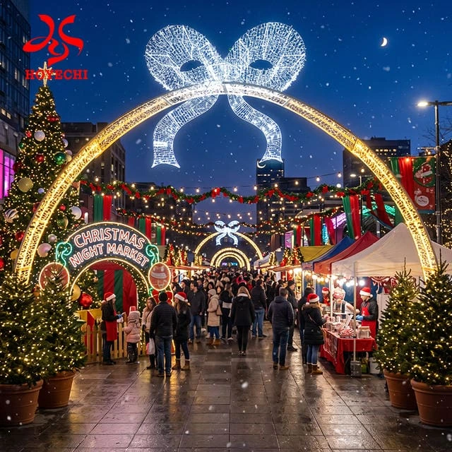 Concept rendering of a white illuminated bow above a walk-through light arch in a Christmas market setting