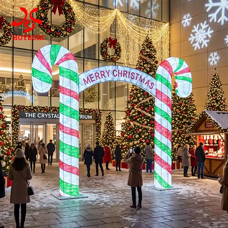 Candy cane Christmas entrance arch with Merry Christmas greeting in a commercial atrium concept