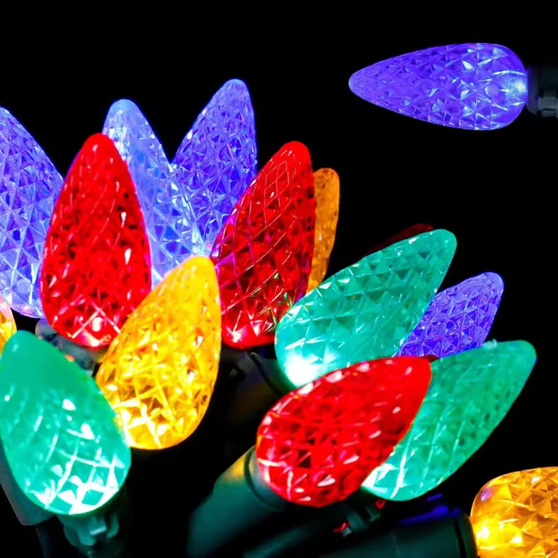 Close-up of red blue green and yellow faceted LED Christmas bulbs