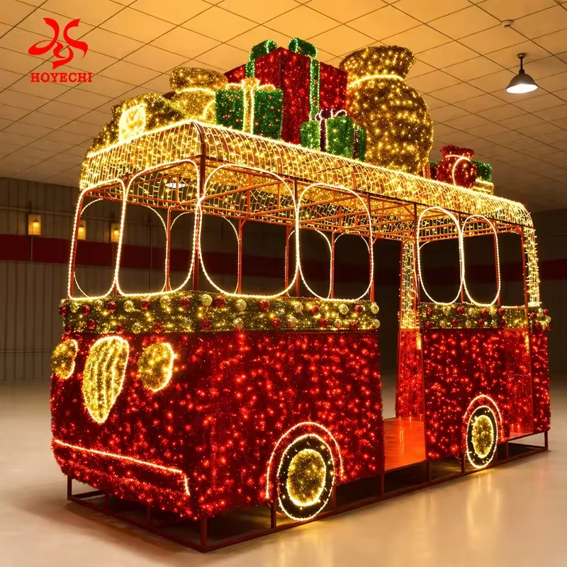 Large red and gold illuminated Christmas bus with rooftop gift decorations