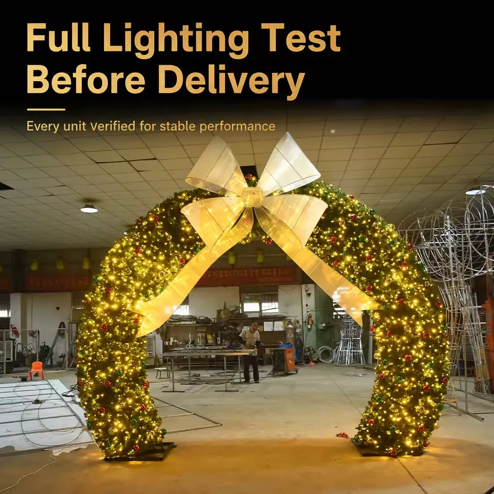 Illuminated green Christmas wreath arch with a gold bow in a workshop setting