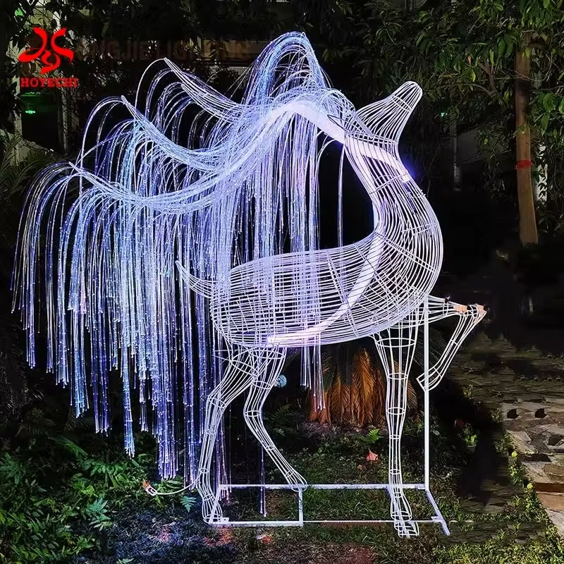 White illuminated reindeer sculpture with flowing fiber optic strands