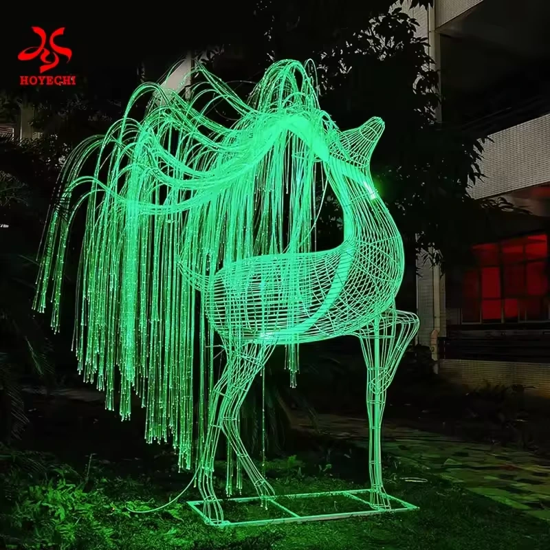 Green fiber optic deer light sculpture on a display base