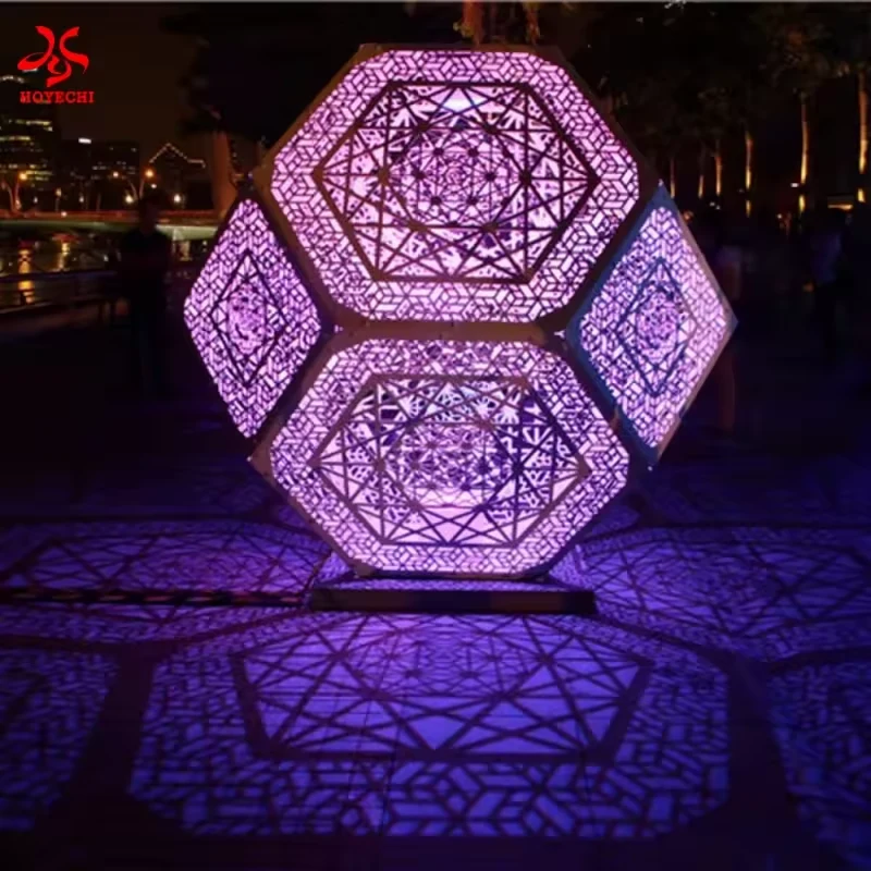 Purple illuminated polyhedron with decorative cutout panels