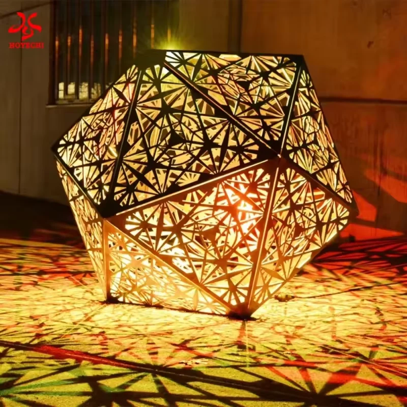 Warm white illuminated metal polyhedron casting patterned shadows