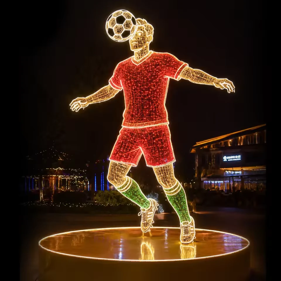 Red uniform football player light sculpture with ball