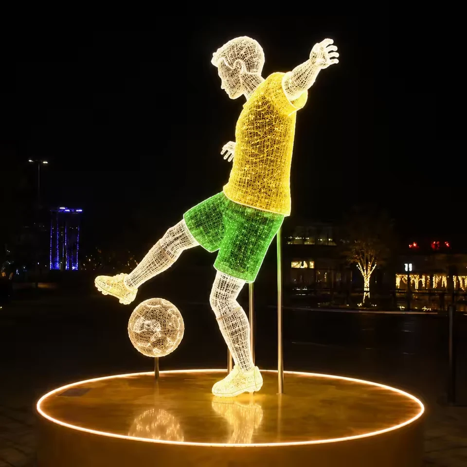 Side view of illuminated football player and ball