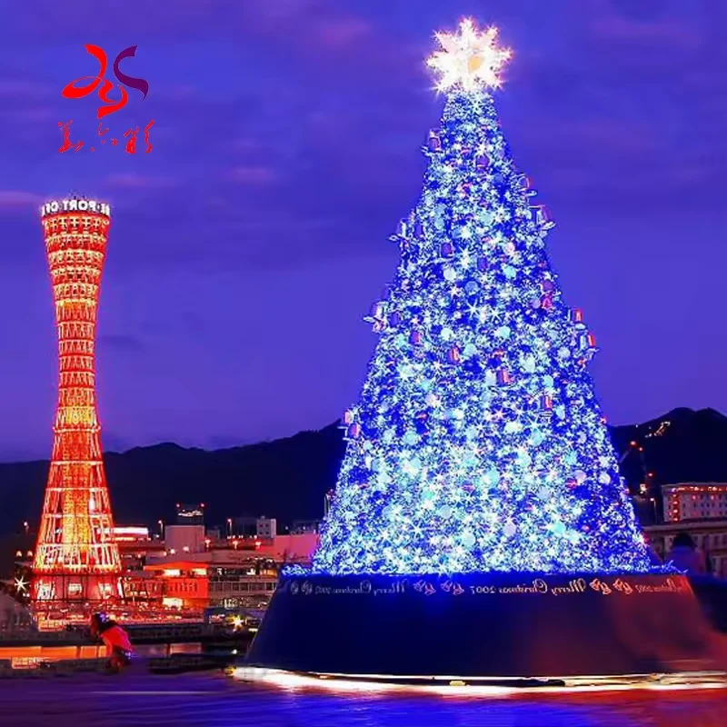 Alternative large blue Christmas tree with snowflake ornaments in an outdoor display