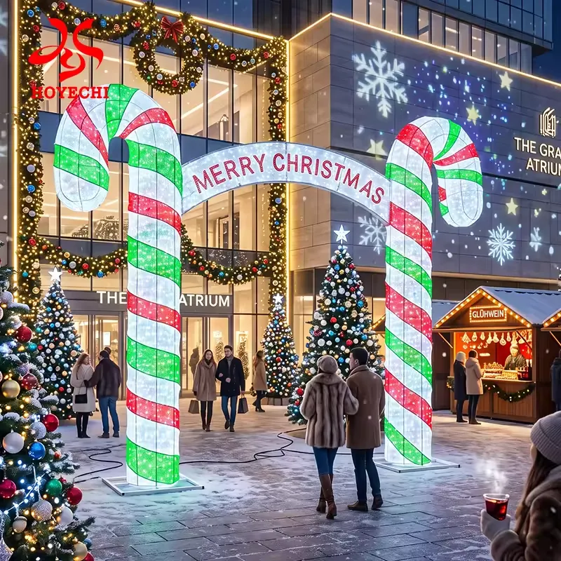 Red, green and white LED candy cane entrance arch with a Merry Christmas banner