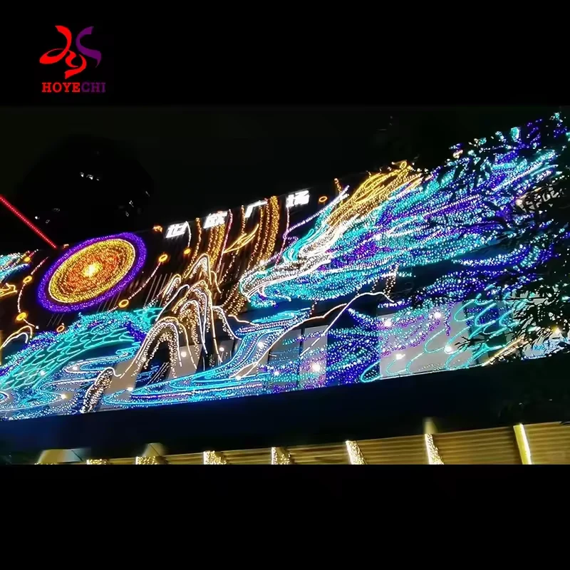 Long illuminated facade panel with mountain and sun motifs