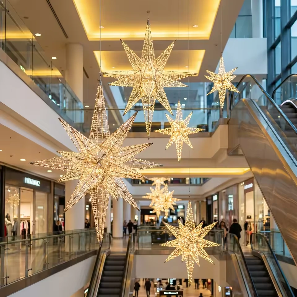 Suspended giant star light display in a commercial atrium