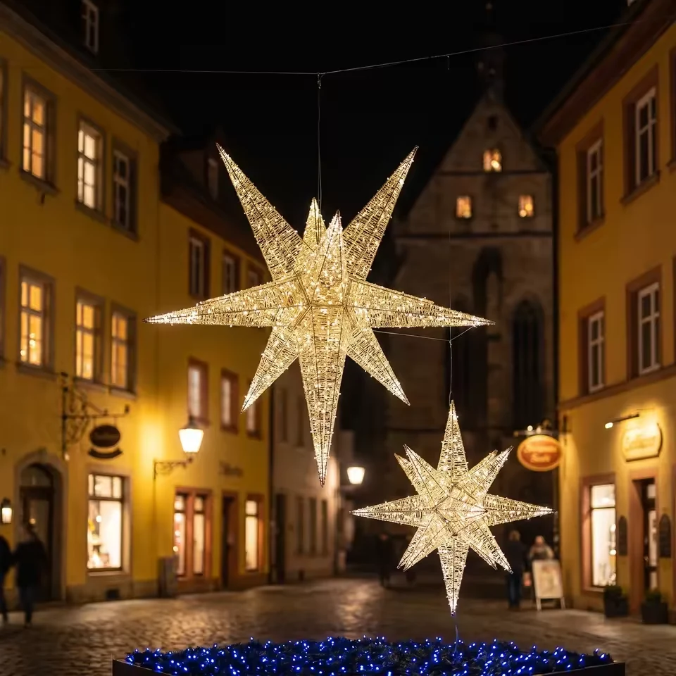 Warm white hanging star lights above a street