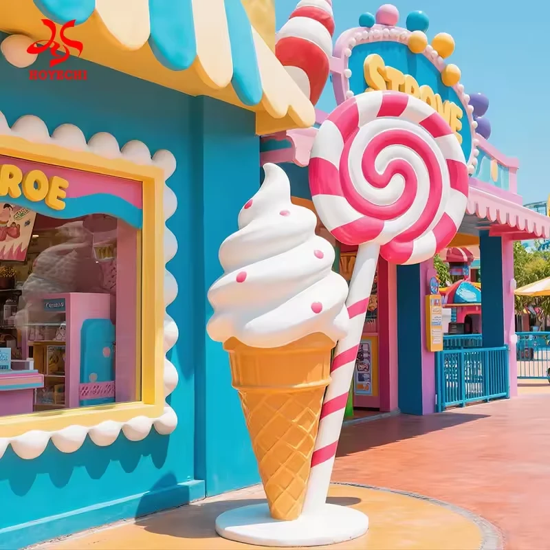 Large ice cream cone and lollipop decorations in a colorful retail scene