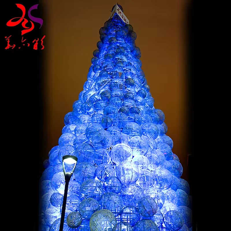 Blue illuminated ball Christmas tree with densely stacked spherical ornaments