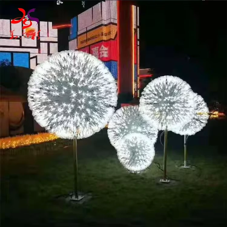 Illuminated white dandelion sculptures arranged in a landscape