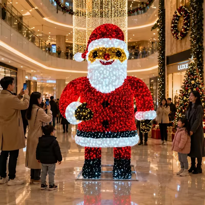 Giant standing Santa light sculpture displayed inside a shopping mall