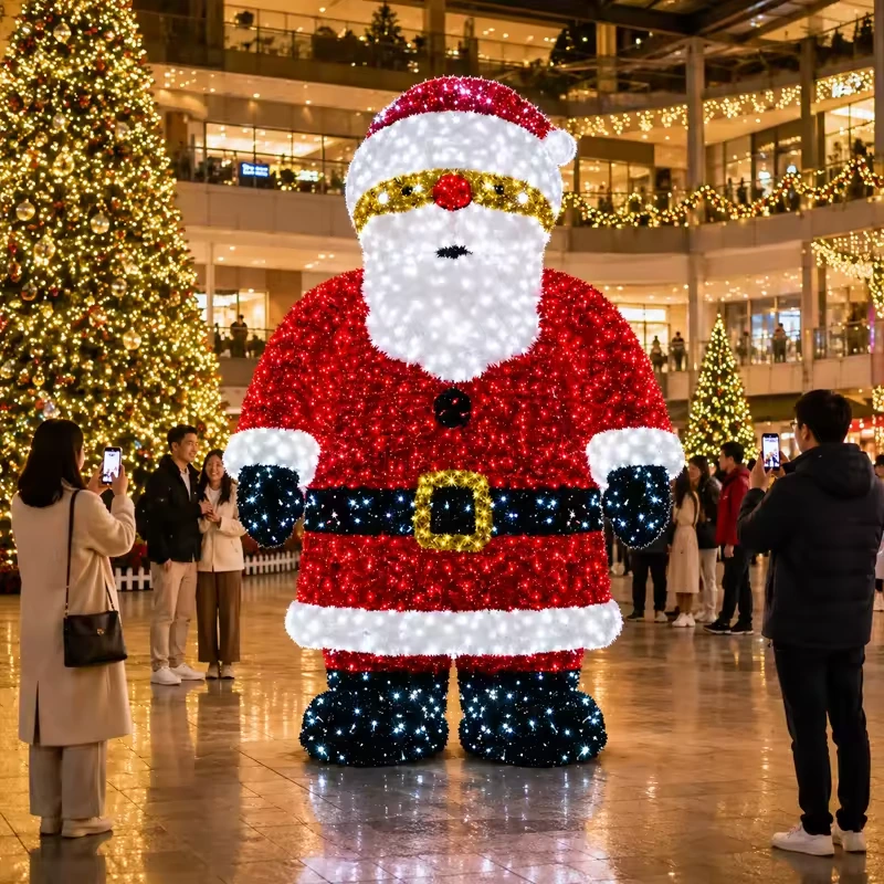 Giant illuminated Santa Claus figure with red coat and white beard
