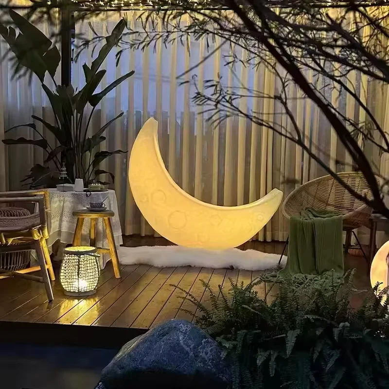 Suspended crescent moon in a garden design reference