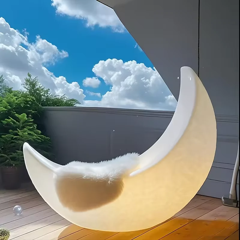 White crescent moon sculpture in a terrace design reference