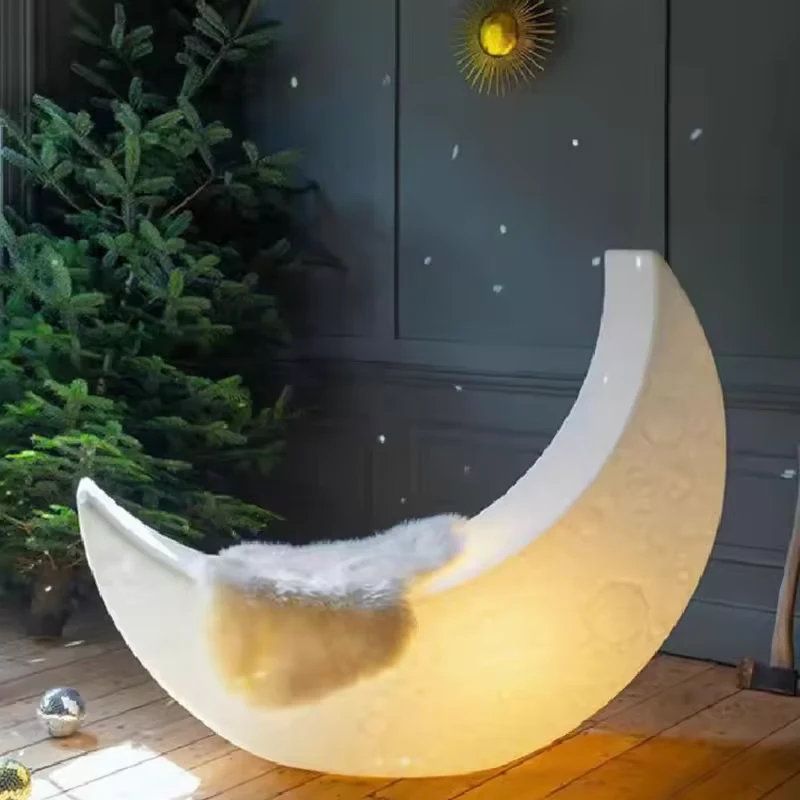 Illuminated crescent moon in a landscaped patio design reference