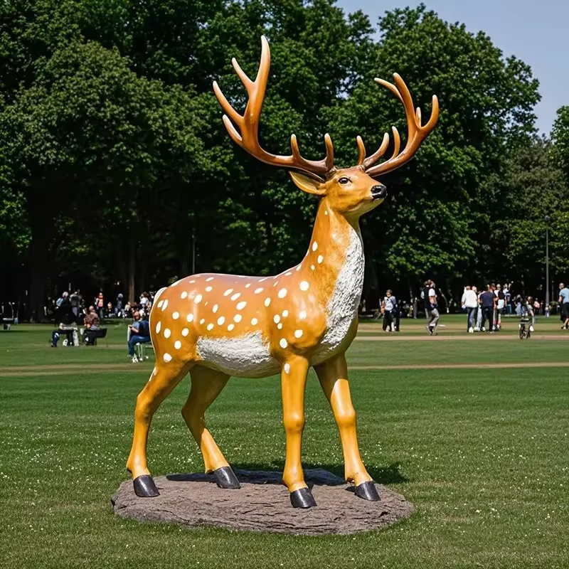 Side view of a fiberglass stag with white spots and large antlers