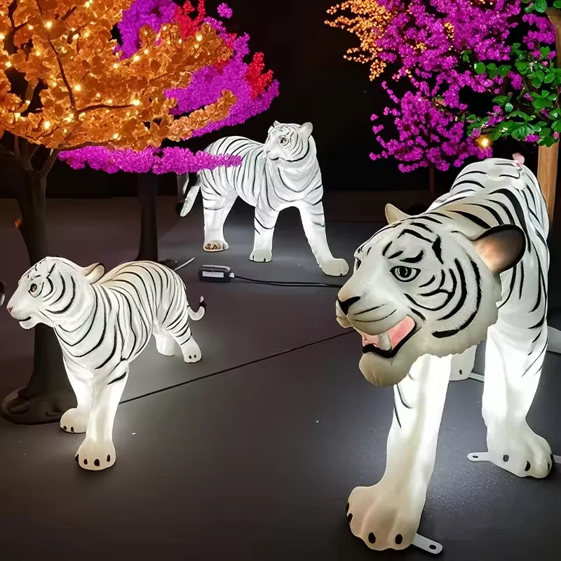 White tiger light sculptures offered as complementary animals in the decorative lighting range