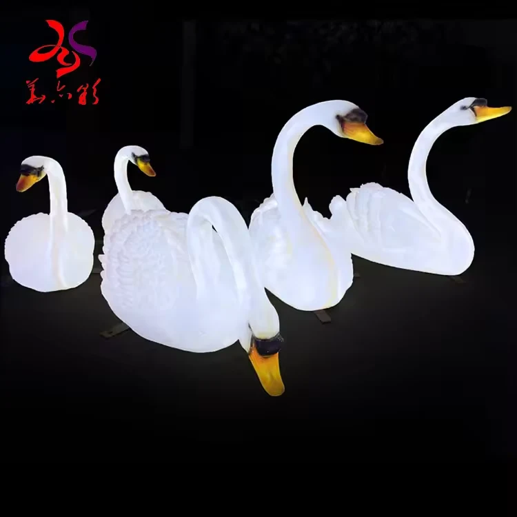 White fiberglass swan light display with detailed feather shapes