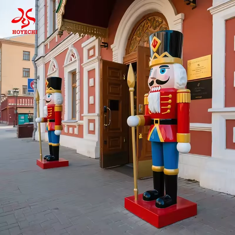 Large red and blue fiberglass nutcracker statues beside a commercial entrance
