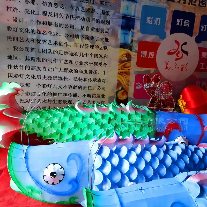 Blue and green fabric fish lanterns showing raised scales and decorative fins