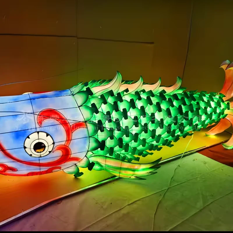 Green LED fish lantern showing the side profile and individual fabric scales