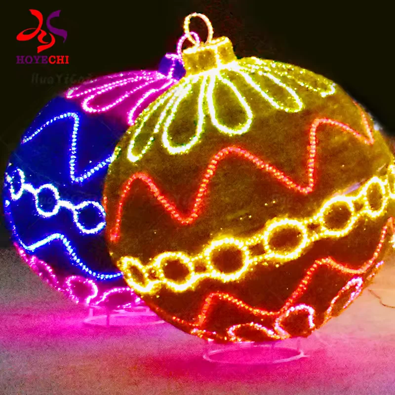 Gold Christmas bauble with red wave patterns and warm white LED outlines