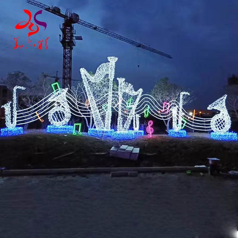 Illuminated harp and musical note display at dusk
