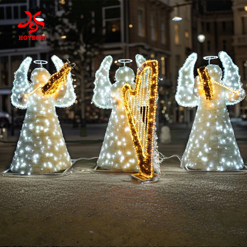 Outdoor 3D Christmas angel motif lights decorating city street at night