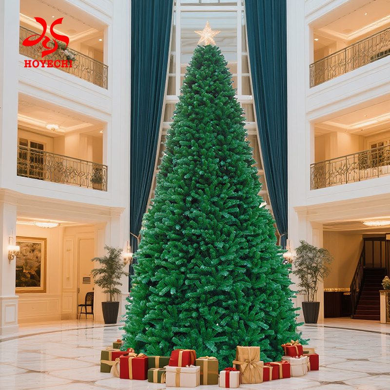 Commercial indoor Christmas tree display with gift boxes in shopping mall atrium
