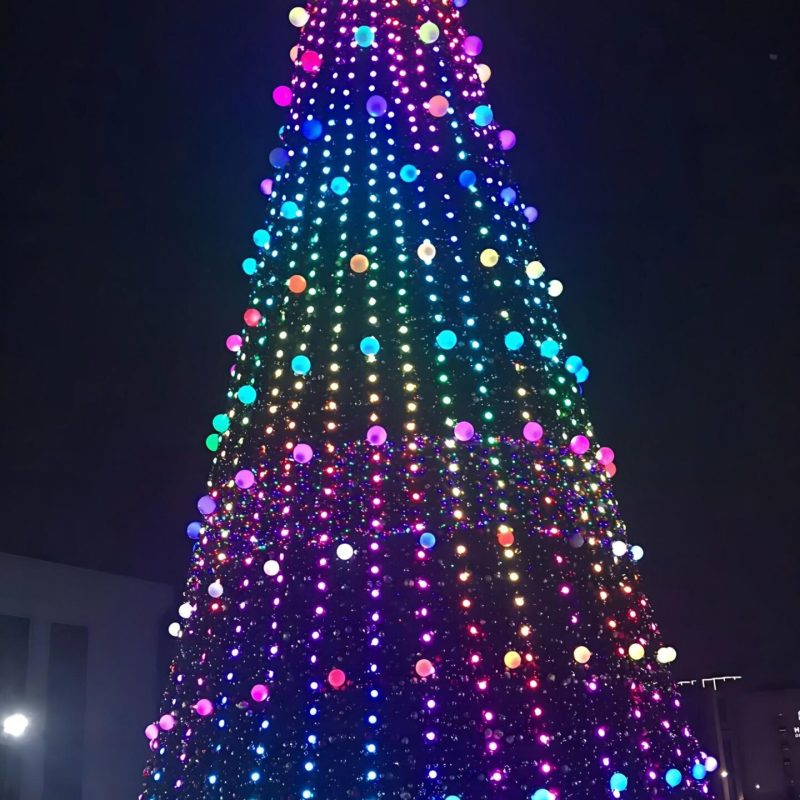 35m giant DMX512 pixel Christmas tree in Tashkent municipal square with synchronized purple and green lighting effects