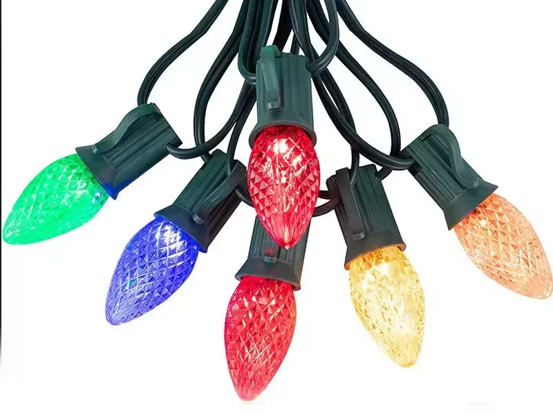 Multicolor C7 C9 LED string lights with faceted bulbs and dark green cable