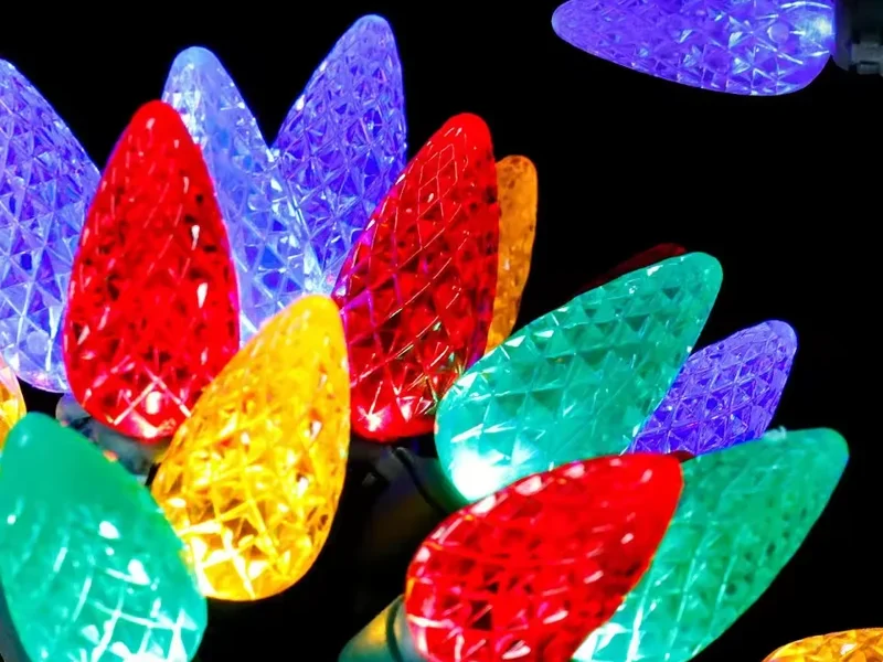 Close-up of red blue green and yellow faceted LED Christmas bulbs