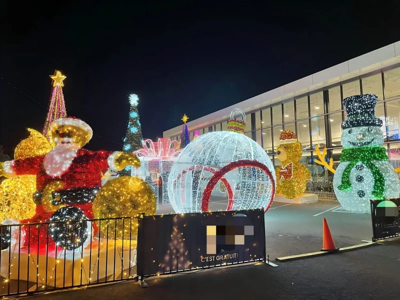 Outdoor Christmas light display with Santa, snowman and a walk-through bauble