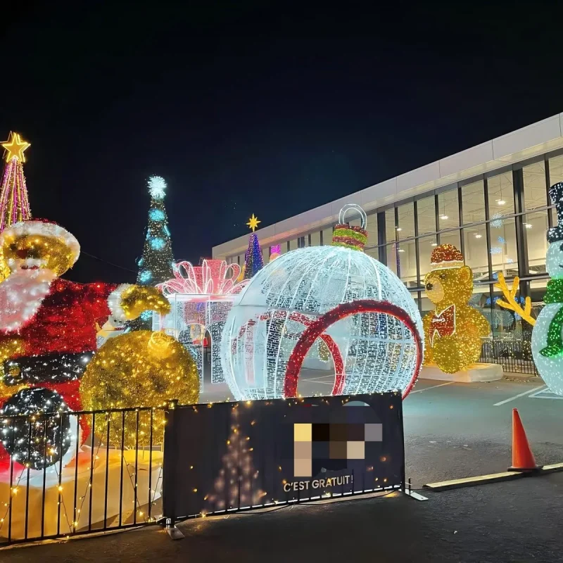 Outdoor Christmas light display with Santa, snowman and a walk-through bauble