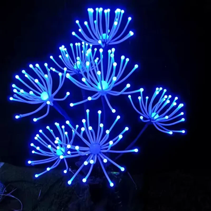 Blue branching fantasy plant sculpture with illuminated tips