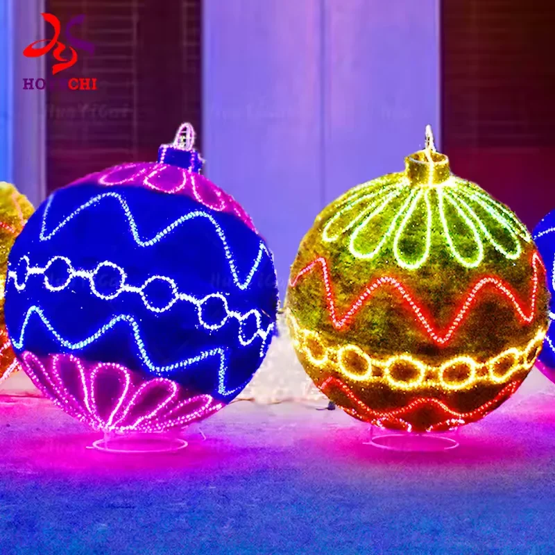 Blue and gold LED Christmas baubles with colorful illuminated patterns