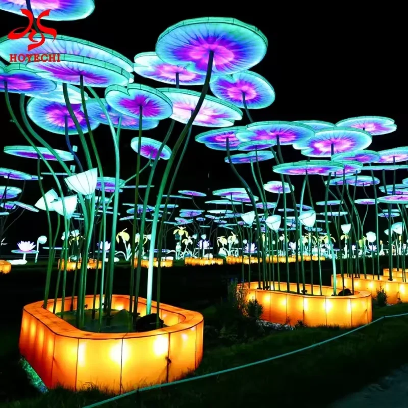 Giant illuminated lotus leaves on tall stems with amber display bases